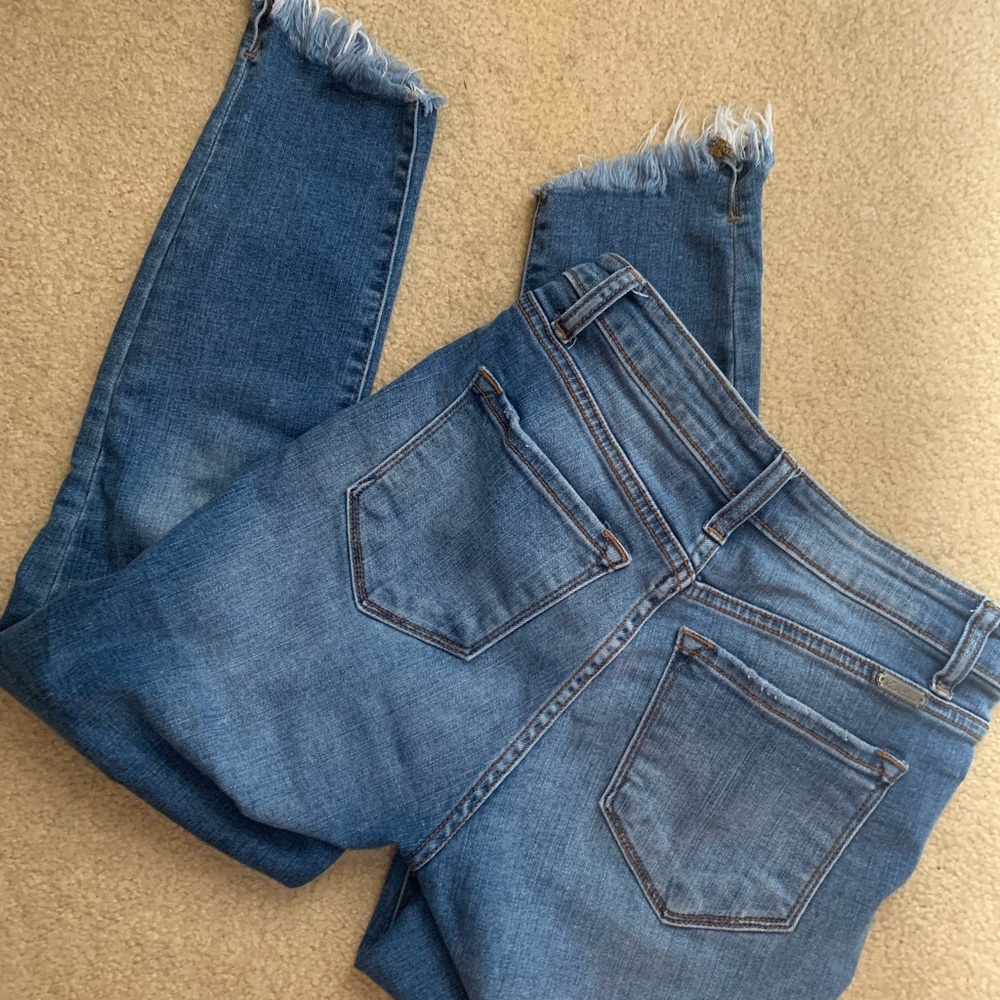 Distressed at ankle skinny jean